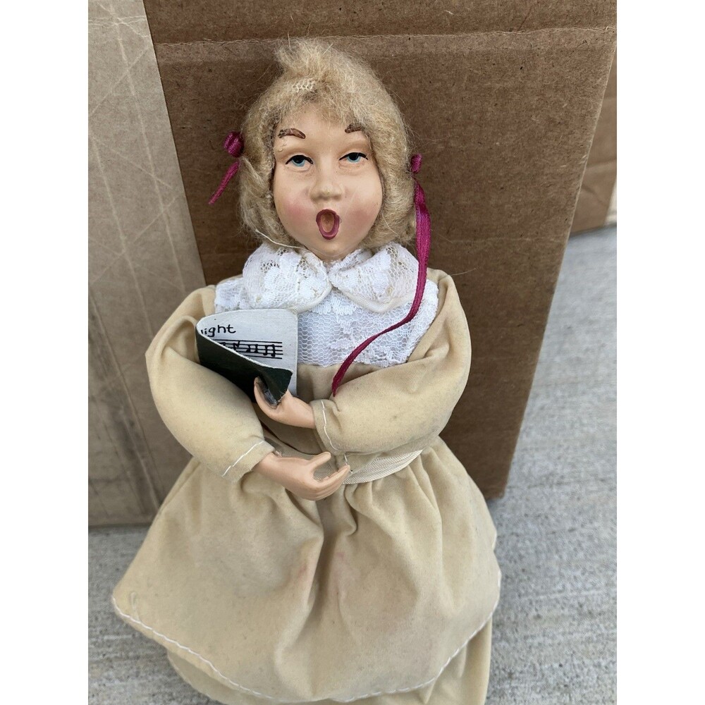 Christmas Caroler Woman Girl Figure 9 in. doll tan coat pink ribbons No Stand